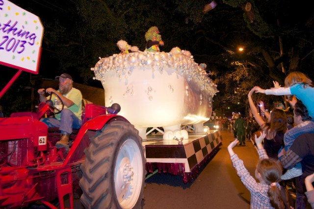 The Bathing Muses, an overflowing bubble bath float, holds members of the all-female krewe as they throw beads and other trinkets, including their famous glitter shoes.