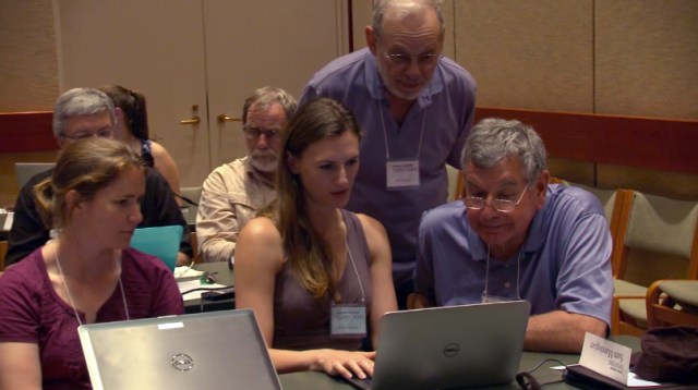Krista giving feedback during a one-on-one critique with a workshop participant in Washington, DC.