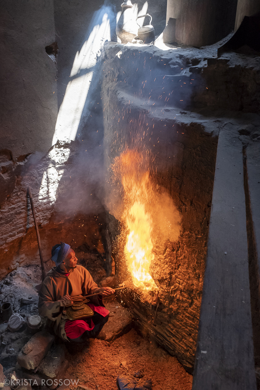 A man stokes the fire at a hammam inside of the Medina of Marrakech, Morocco.